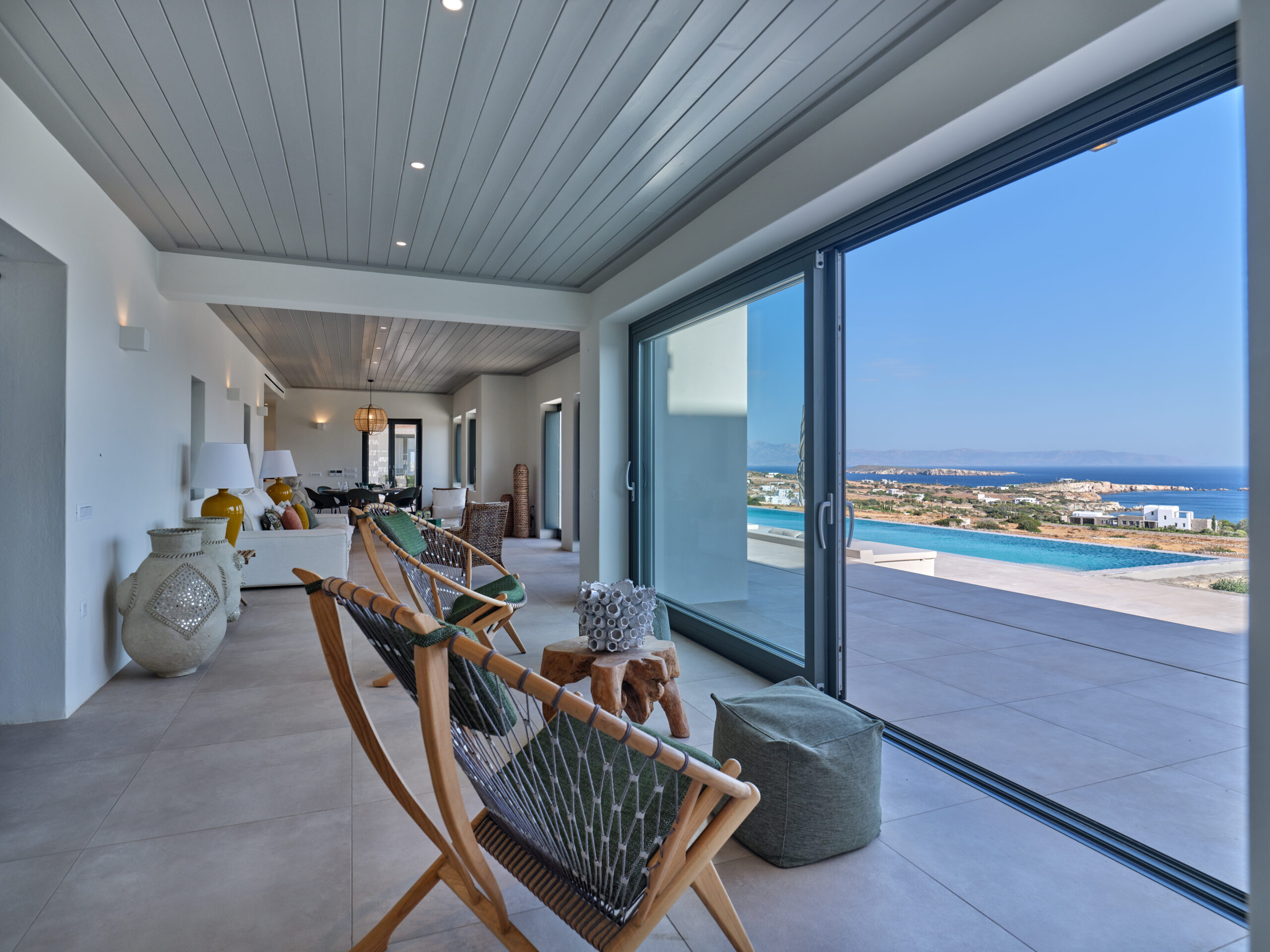 A stylish living room with an unobstructed sea view to the Aegean!